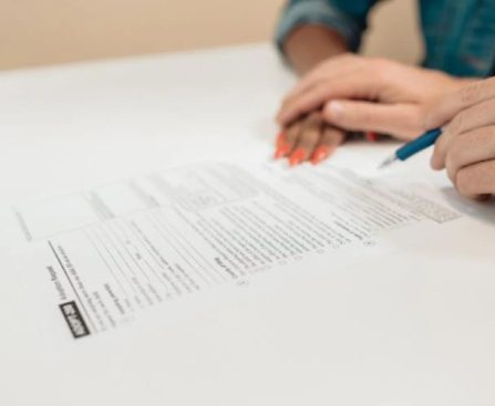 Person Writing on White Paper